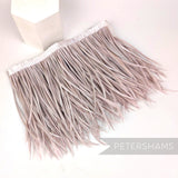 Petershams Millinery Supplies extra long goose biot feather fringe in a soft rose pink shade with satin ribbon binding.