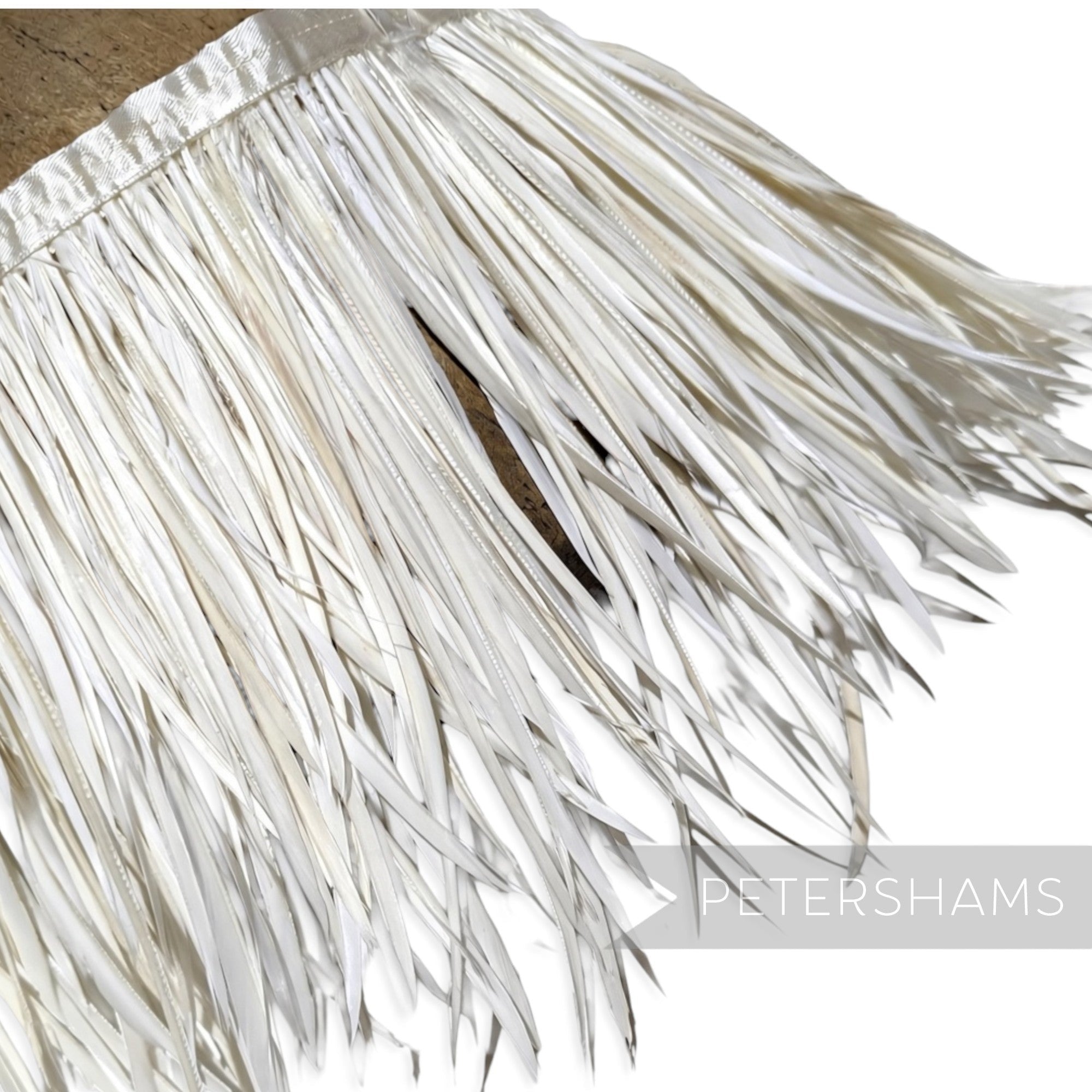Petershams Millinery Supplies extra long ivory goose biot feather fringe with a satin ribbon binding