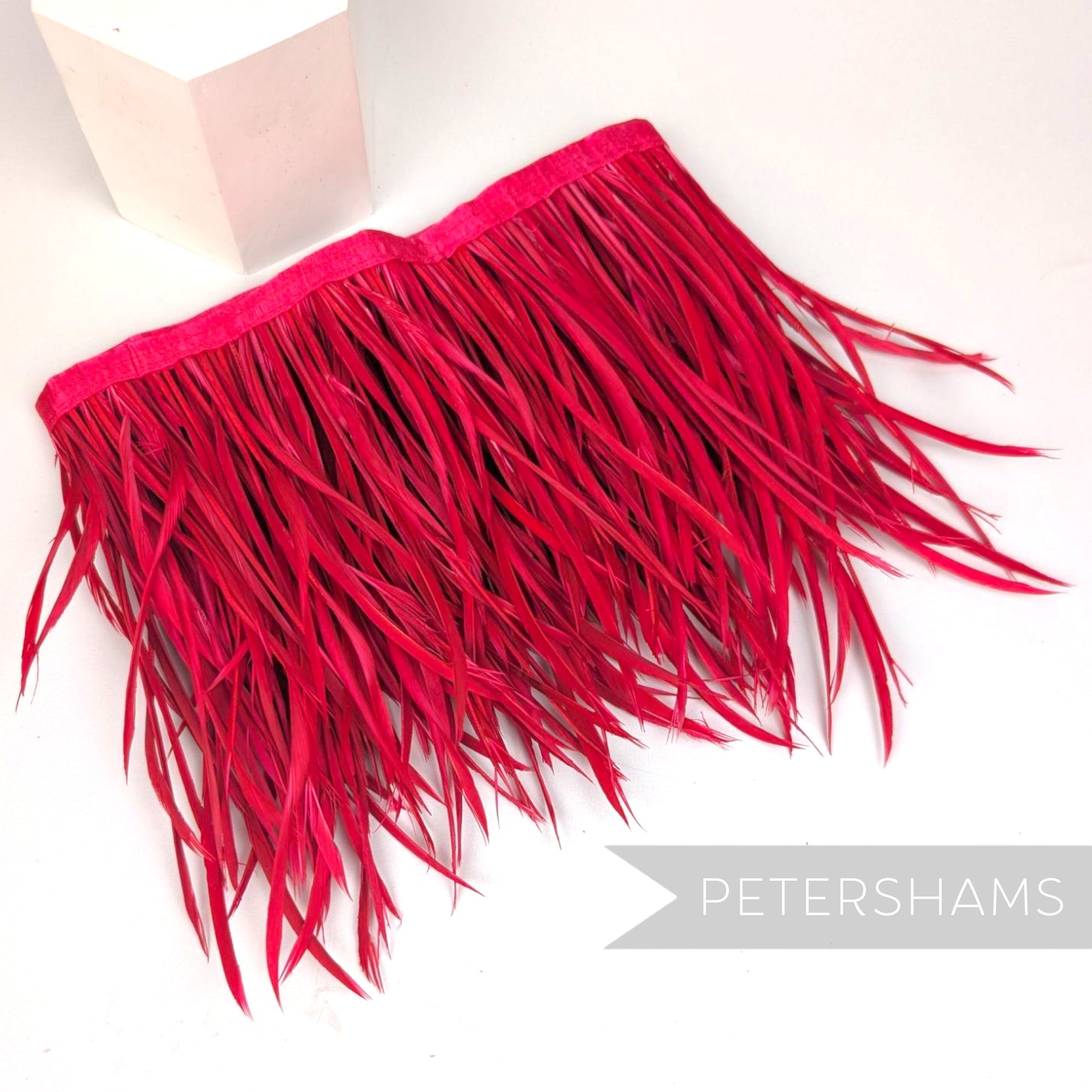 Petershams Millinery Supplies extra long fuchsia goose biot feather fringe on a satin ribbon binding for millinery crafts