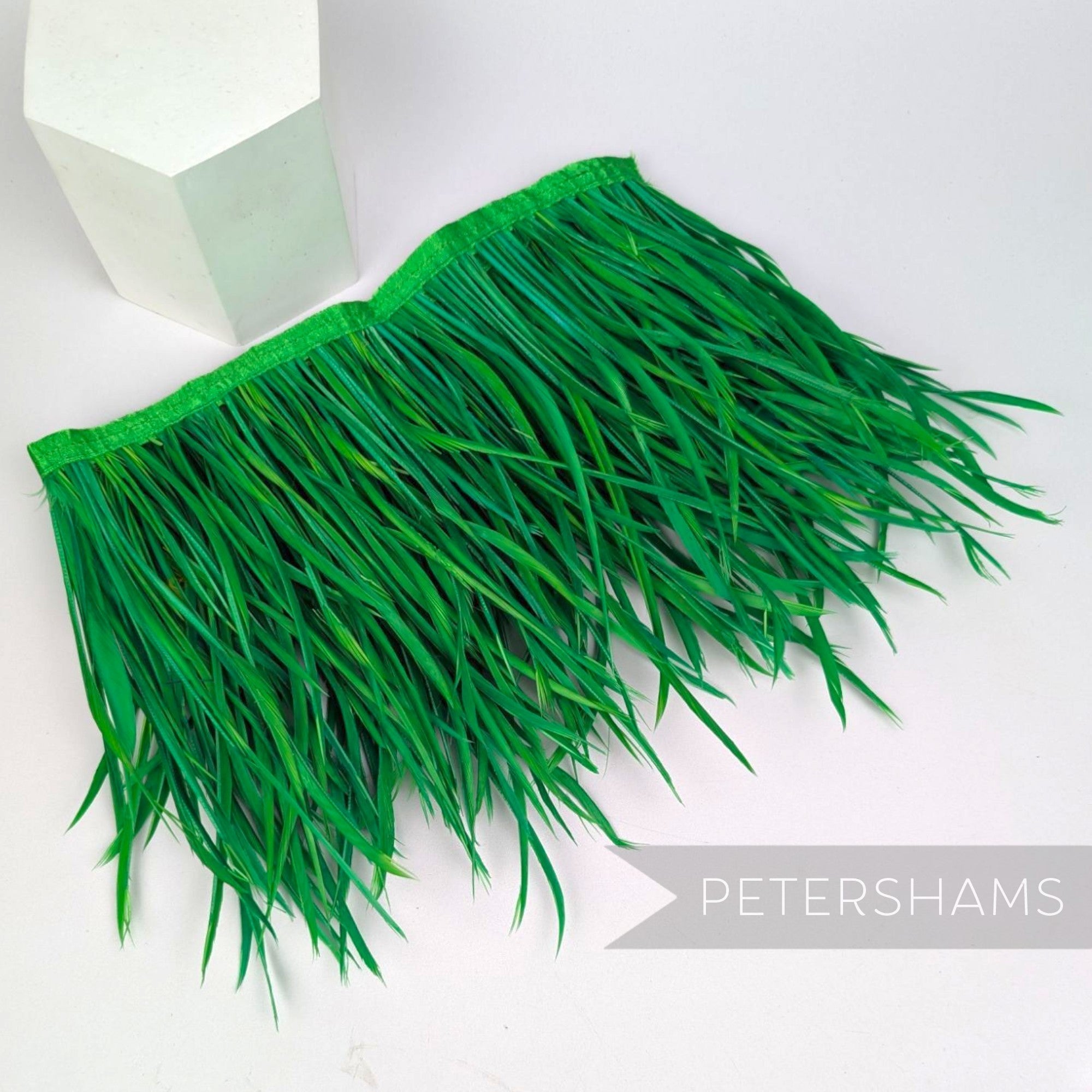 Petershams Millinery Supplies extra long emerald green goose biot feather fringe on a satin ribbon binding for millinery crafts