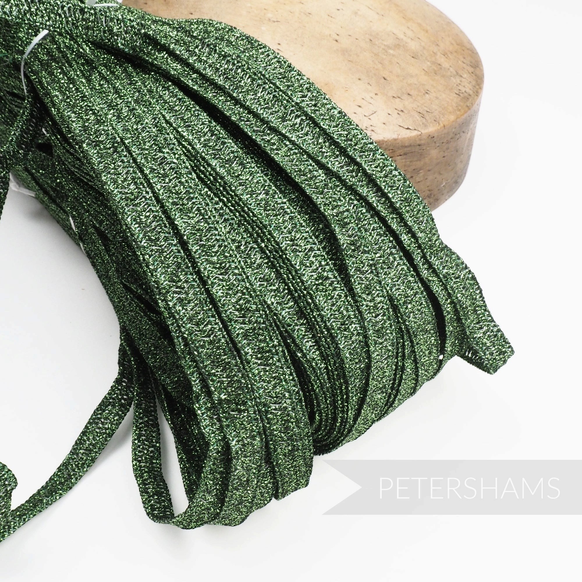 Petershams Millinery Supplies 10mm green metallic lurex hat braid with a raised zig-zag texture in a full 80m hank.