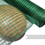 Petershams Millinery Supplies bottle green basket weave sinamay fabric draped over a wooden hat block for millinery projects