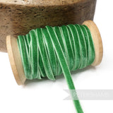 Petershams Millinery Supplies 7mm vintage green rayon velvet ribbon on a wooden spool