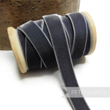 Petershams Millinery Supplies 16mm grey elasticated velvet ribbon on a wooden spool for millinery and craft projects.