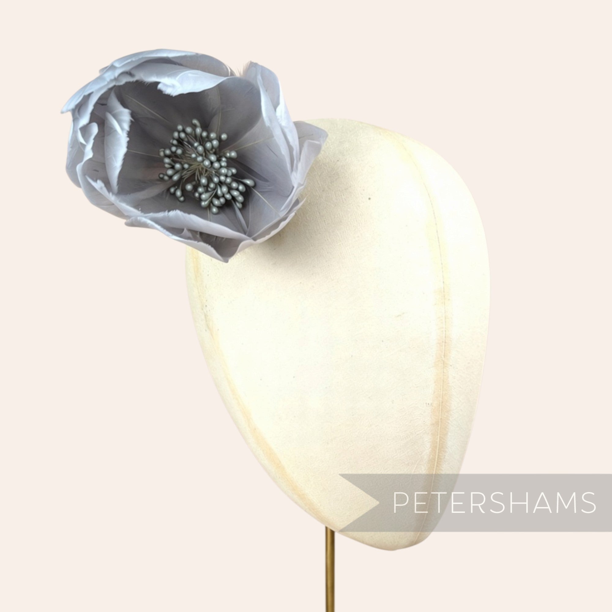 Petershams Millinery Supplies large grey tulip-shaped goose nagorie feather flower with a central stamen cluster.