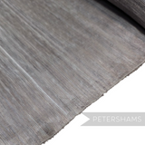 Petershams Millinery Supplies fine polyester abaca fabric in a neutral grey tone with a subtle sheen and woven texture.