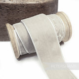 Petershams Millinery Supplies 36mm wide light grey French velvet ribbon on a wooden spool with a luxurious sheen.