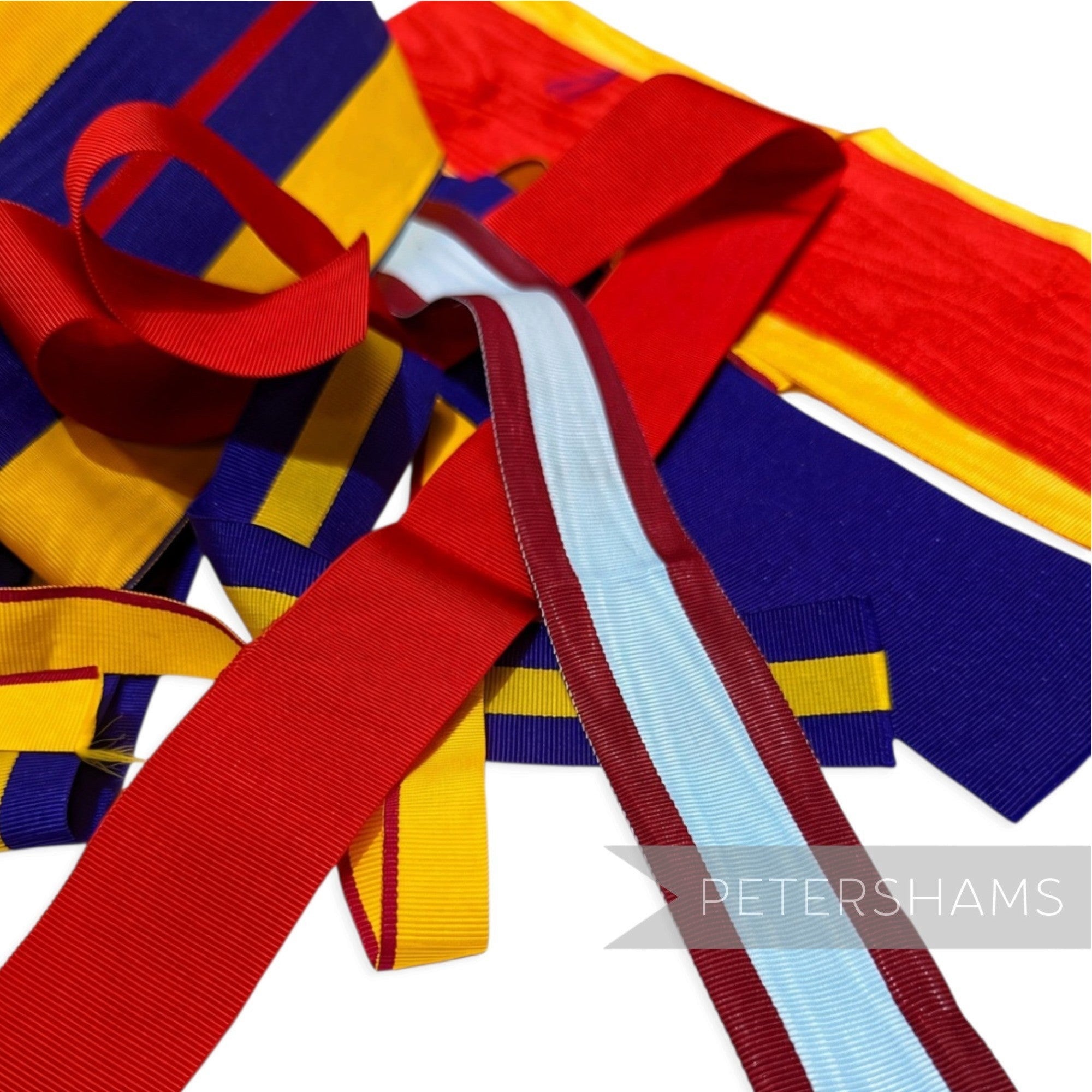 Petershams Millinery Supplies grosgrain ribbon remnant bundle featuring assorted red, yellow, blue, and striped pieces.
