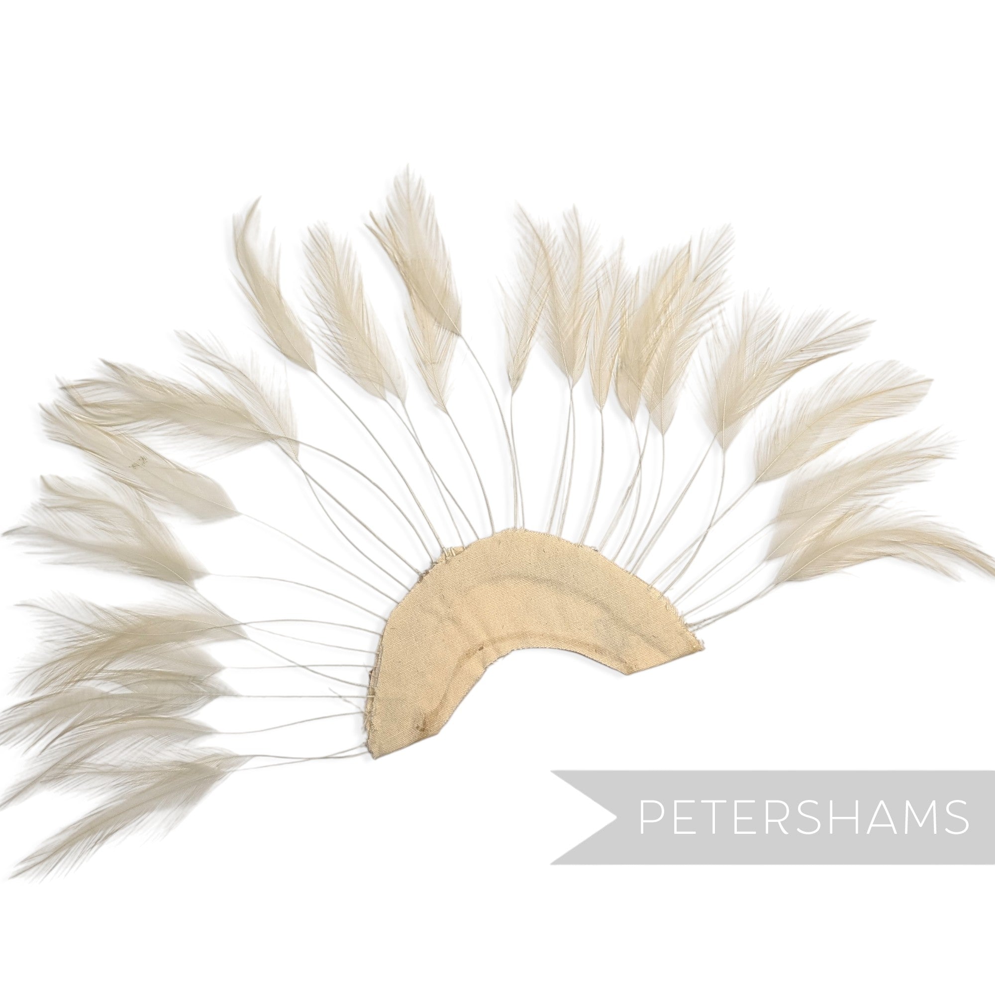 Petershams Millinery Supplies beige stripped hackle feather fan on a cotton base for hat and fascinator trimming.