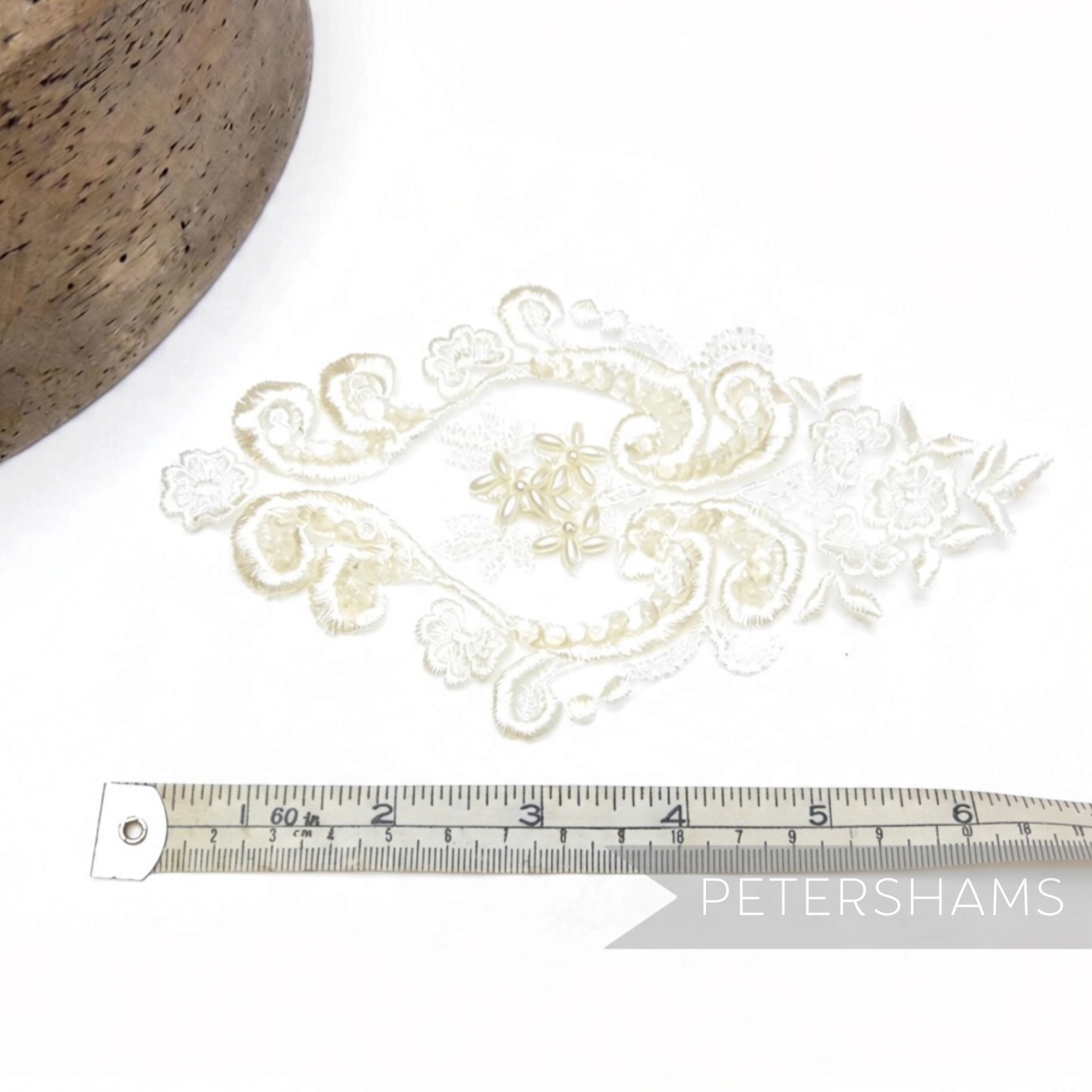 Petershams Millinery Supplies heart-shaped white lace motif with faux pearls and iridescent sequins for bridal wear