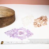 Petershams Millinery Supplies heart-shaped lace motifs in lilac, white, and champagne with pearls and sequins.