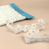 Petershams Millinery Supplies vintage 1950s ivory cotton guipure lace trim with infinity fleur floral pattern