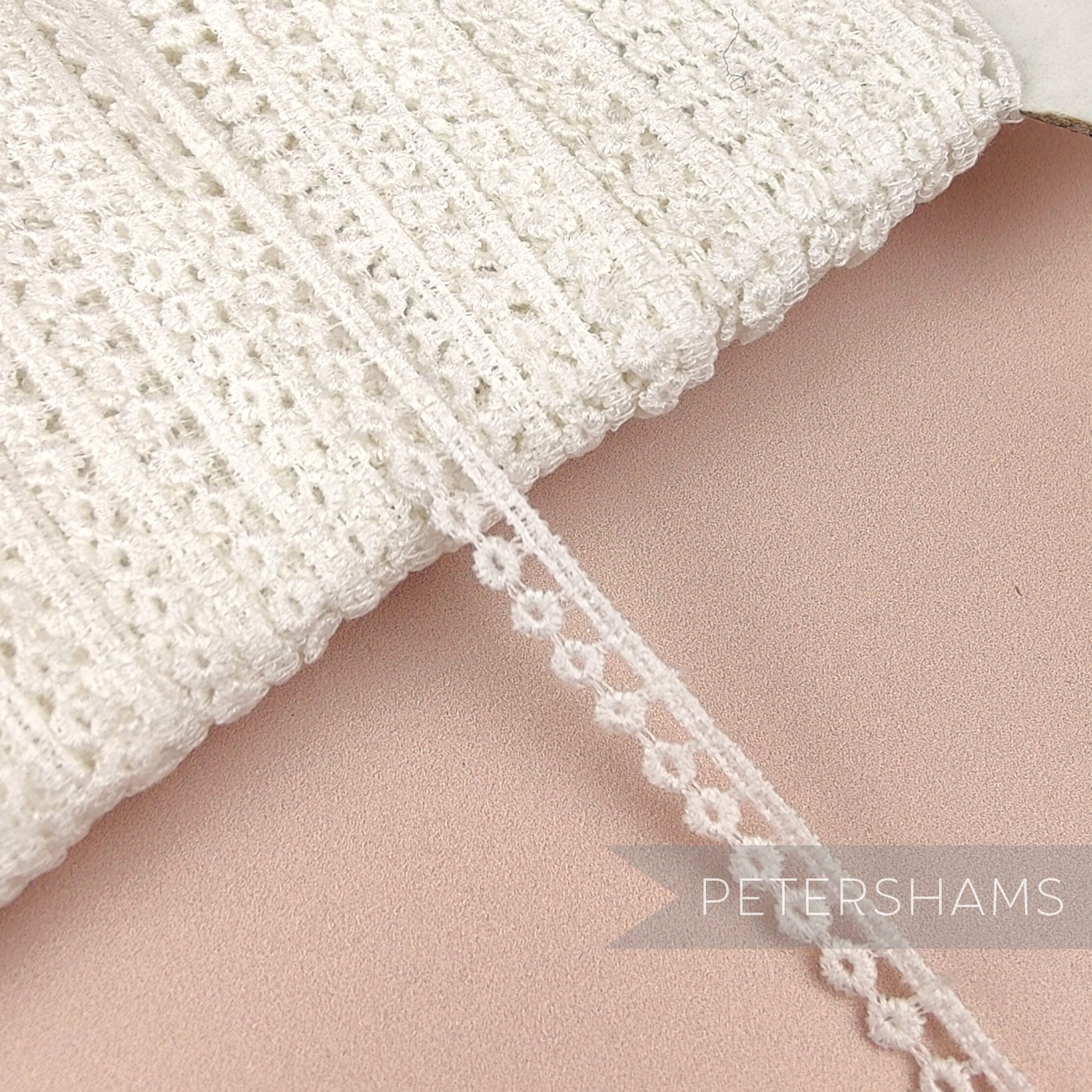 Petershams Millinery Supplies vintage 6mm ivory cotton guipure lace trim with a delicate doughnut pattern.