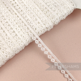 Petershams Millinery Supplies vintage 6mm ivory cotton guipure lace trim with a delicate doughnut pattern.
