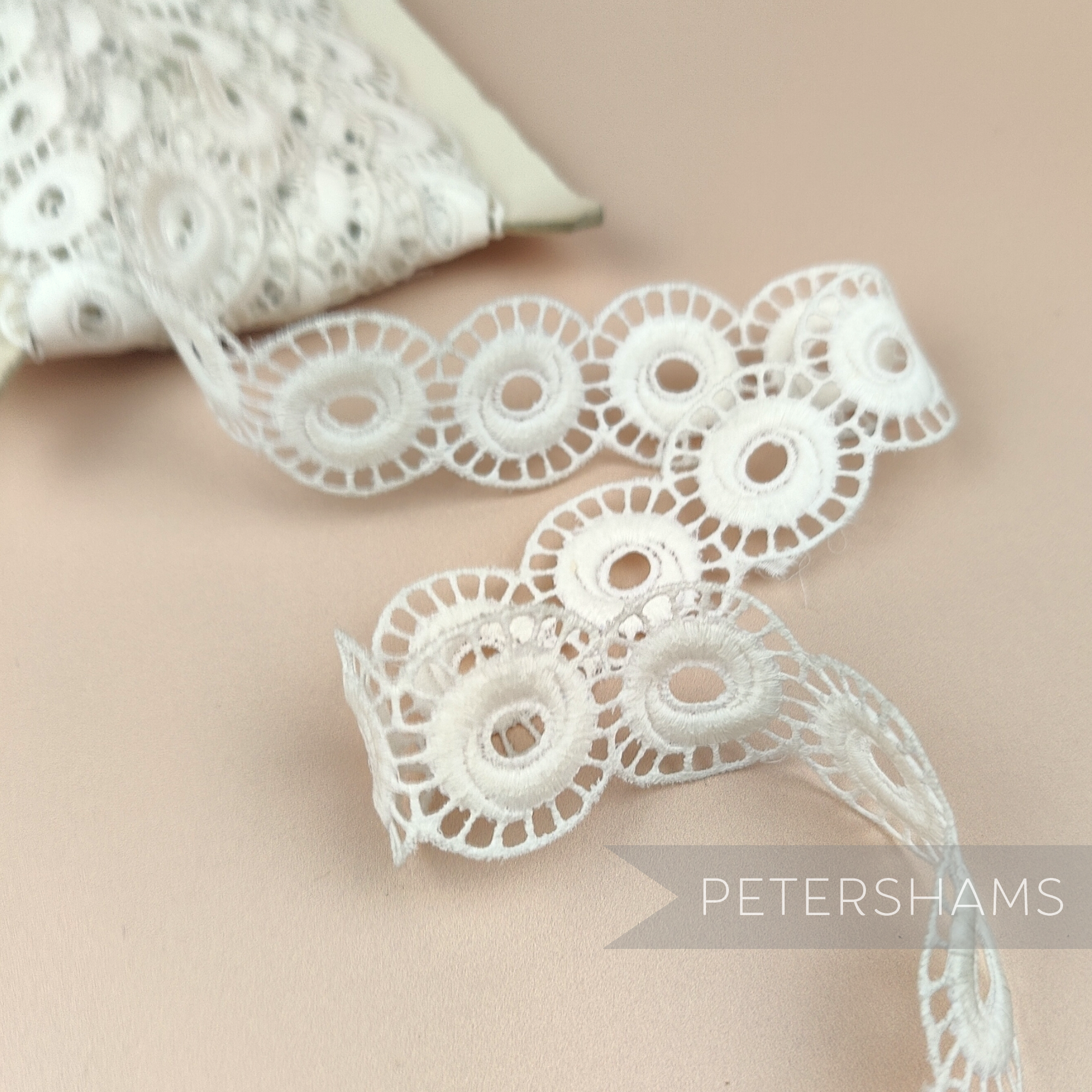 Petershams Millinery Supplies vintage 1950s ivory cotton guipure lace trim with an open whirl design