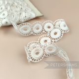 Petershams Millinery Supplies vintage 1950s ivory cotton guipure lace trim with an open whirl design