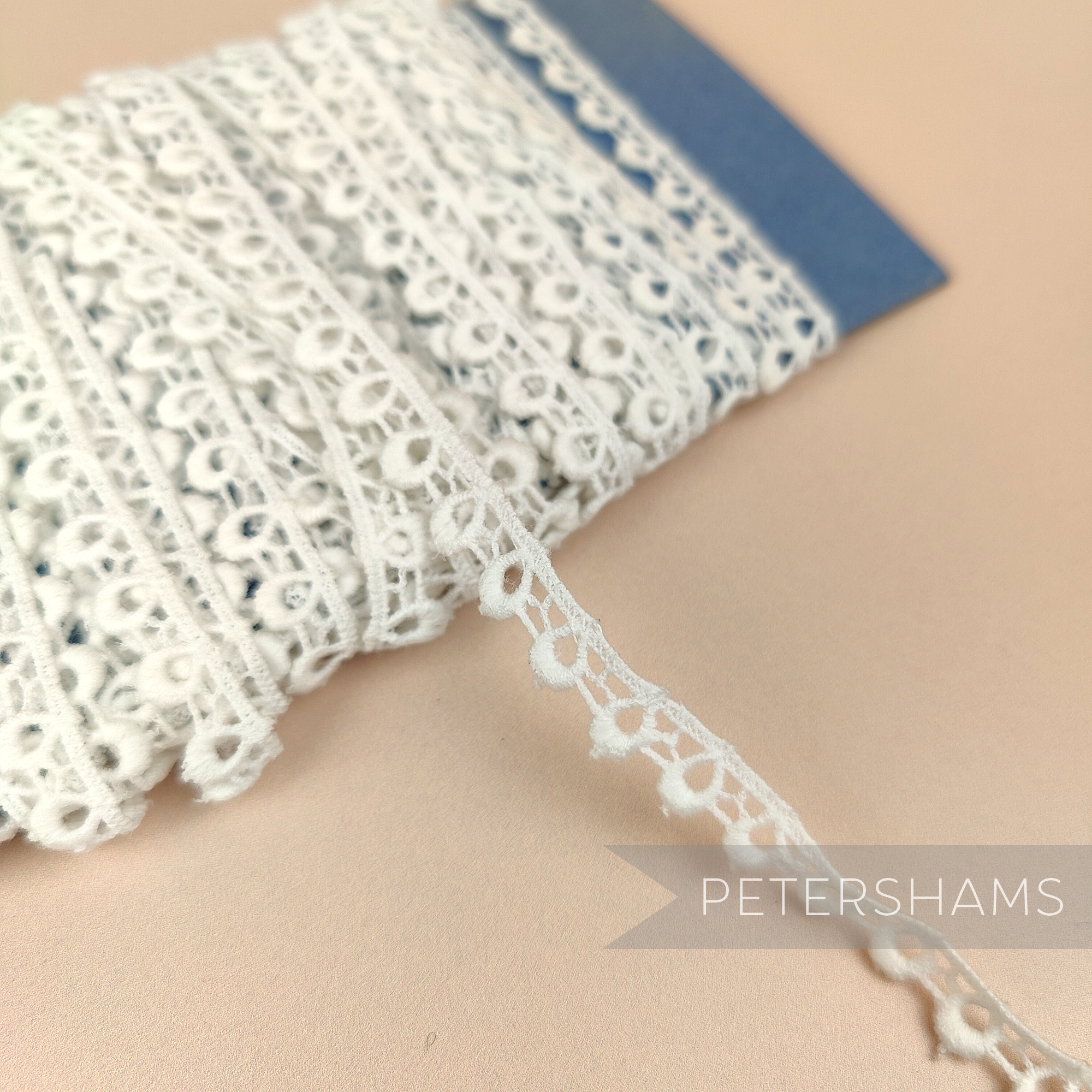 Petershams Millinery Supplies ivory 9mm cotton guipure lace trim with a vintage 1950s peephole scallop pattern