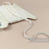 Petershams Millinery Supplies vintage 8mm ivory cotton guipure lace trim with a spotted club and swag pattern.