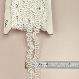Petershams Millinery Supplies vintage 30mm ivory cotton guipure lace trim with a geometric horn scallop design.