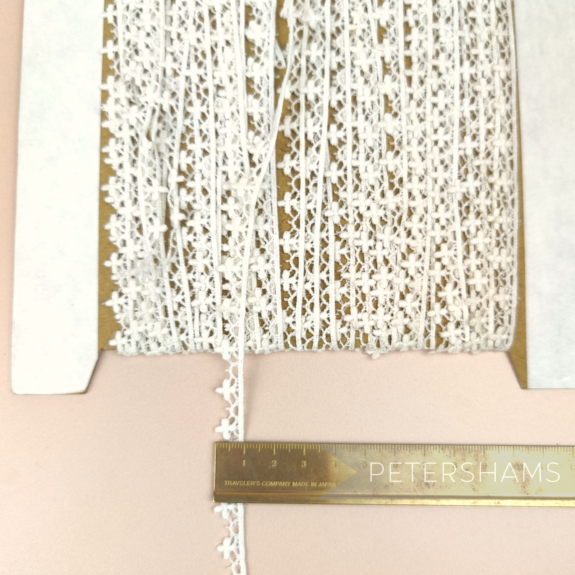 Petershams Millinery Supplies vintage 10mm ivory cotton guipure lace trim with a delicate club and scallop design.