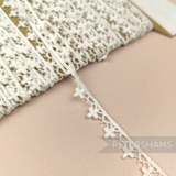 Petershams Millinery Supplies 10mm ivory cotton guipure lace trim with vintage club design and scalloped edges.