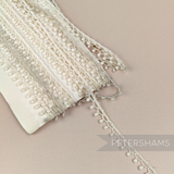 Petershams Millinery Supplies 8mm ivory dotted drop lace trim on a vintage card, ideal for sewing and craft projects.