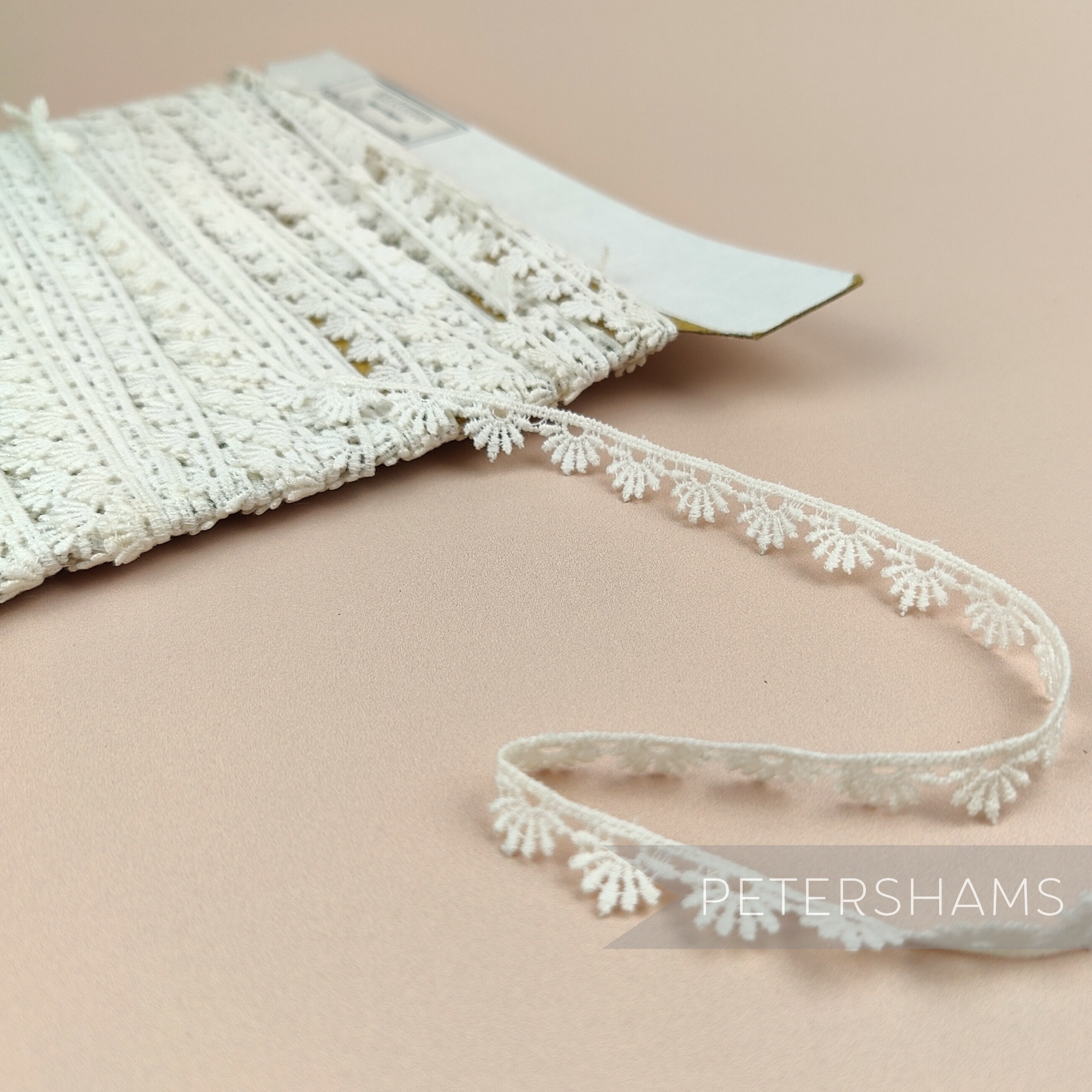Petershams Millinery Supplies vintage 10mm ivory guipure lace trim with a delicate radiant fan design on a spool