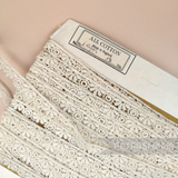 Petershams Millinery Supplies vintage ivory guipure lace trim with a 12mm wide tumbling leaf pattern on a spool.