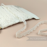 Petershams Millinery Supplies vintage 12mm ivory guipure lace trim with a delicate tumbling leaf and wave pattern.