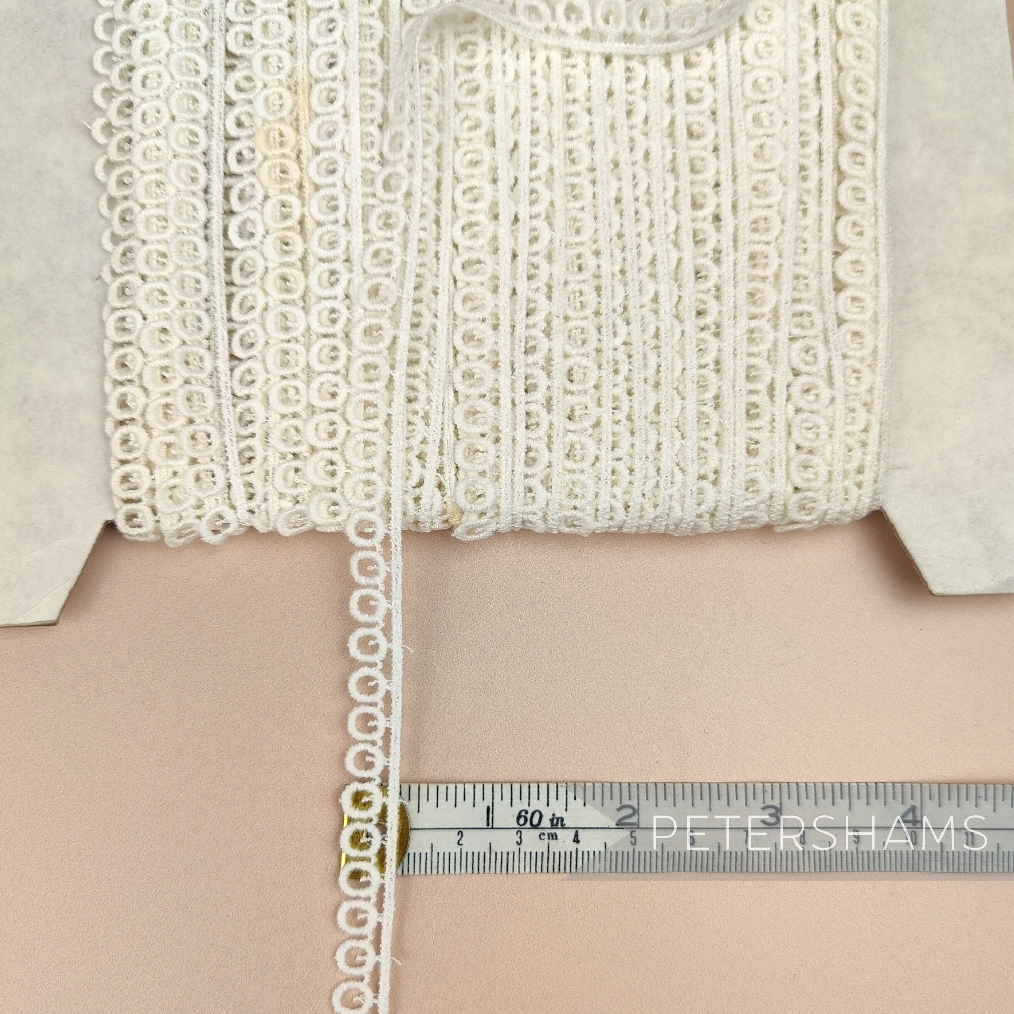 Petershams Millinery Supplies vintage 10mm ivory guipure lace trim with a mini ring pattern on a spool