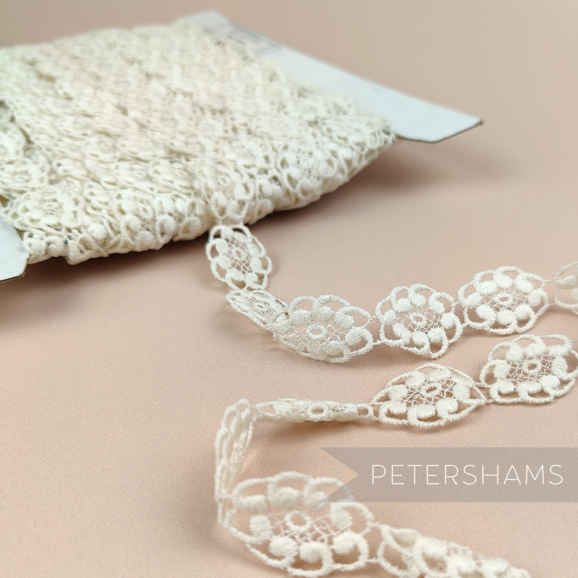 Petershams Millinery Supplies vintage 20mm ivory guipure lace trim with an oval princess floral design