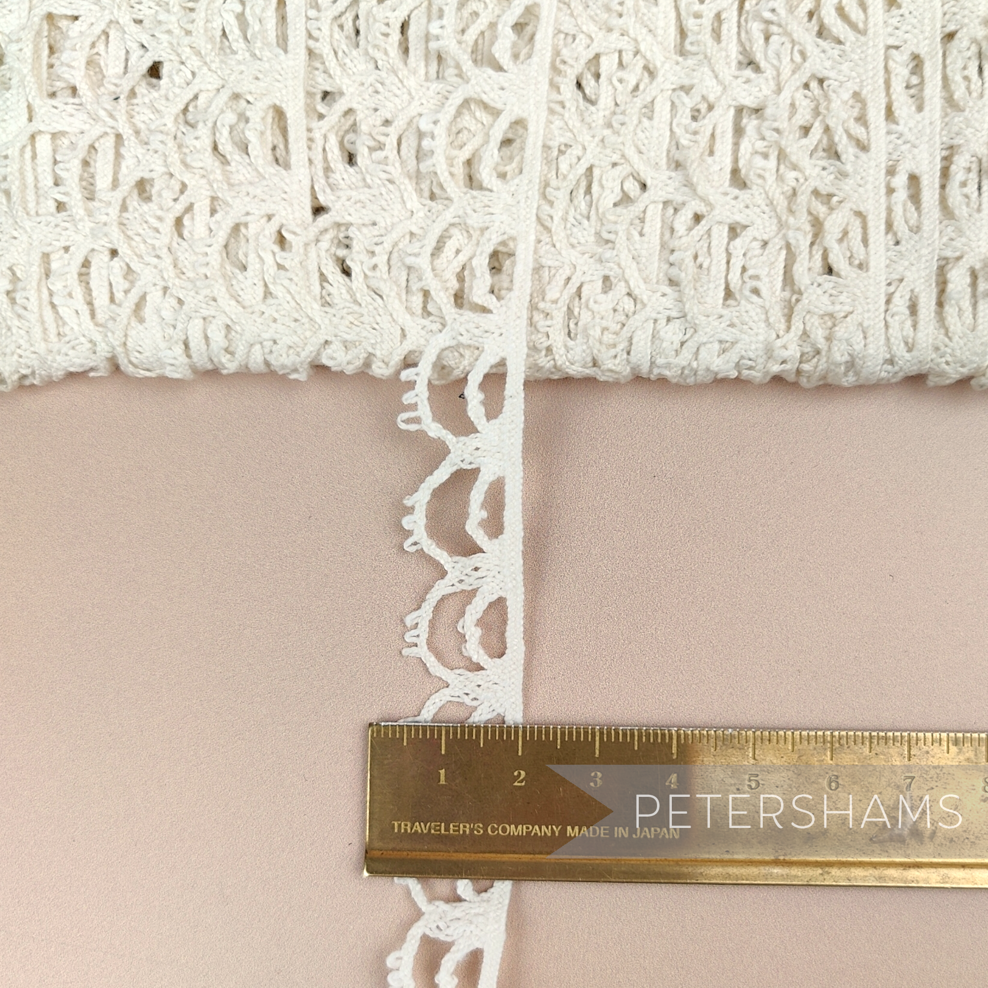 Petershams Millinery Supplies vintage 16mm ivory guipure lace trim with a delicate double swag pattern.