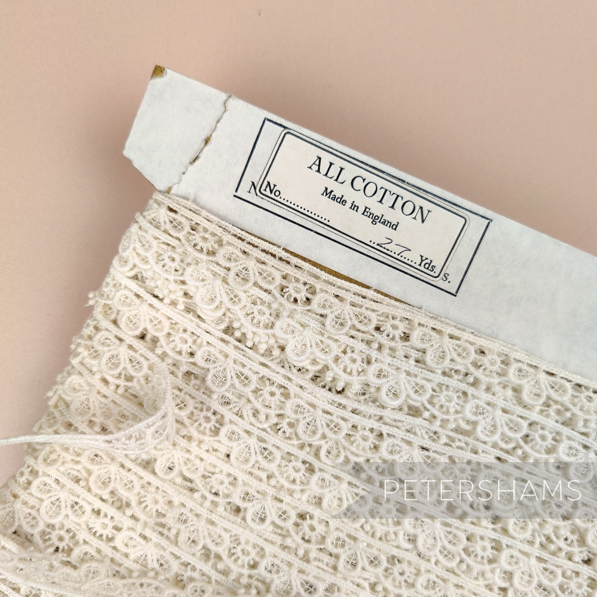 Petershams Millinery Supplies vintage ivory guipure lace trim with a 12mm sunshine petal design on a paper spool