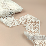 Petershams Millinery Supplies 6cm ivory guipure lace trim with a vintage filigree design for bridal sewing projects.