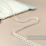 Petershams Millinery Supplies vintage 10mm ivory guipure lace trim with a delicate mini ring design on a spool