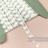 Petershams Millinery Supplies vintage 14mm ivory cotton guipure lace trim with a captains wheel pattern on a card