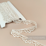 Petershams Millinery Supplies vintage ivory guipure lace trim with a 20mm loopidy loo pattern on a cardboard spool