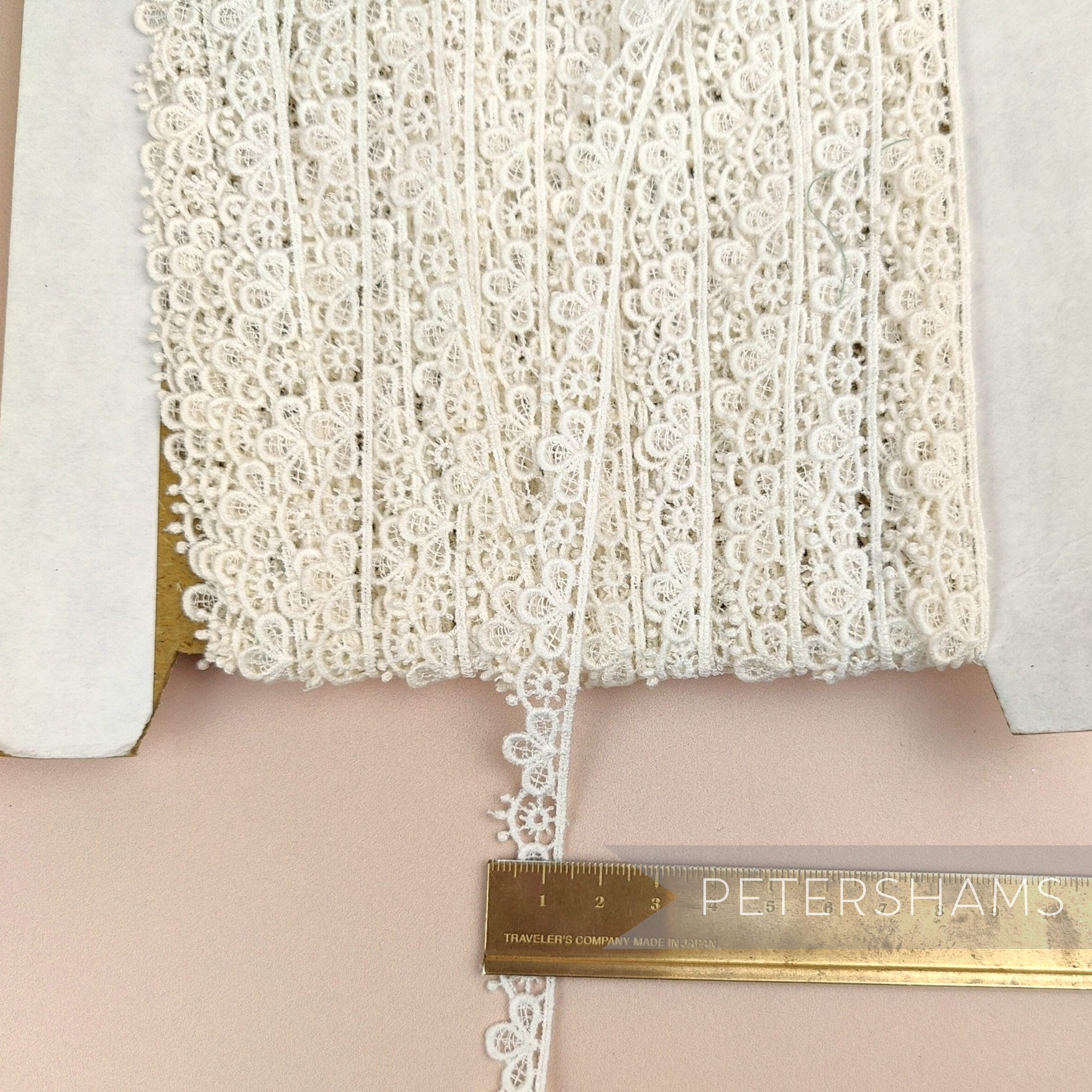 Petershams Millinery Supplies vintage ivory guipure lace trim with a 12mm sunshine petal design on a spool
