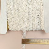 Petershams Millinery Supplies vintage ivory guipure lace trim with a 12mm sunshine petal design on a spool