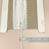 Petershams Millinery Supplies vintage 12mm ivory guipure lace trim with an eyelash wheel design on a cardboard spool.