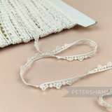 Petershams Millinery Supplies vintage ivory 9mm guipure lace trim with a delicate mini club dotted design