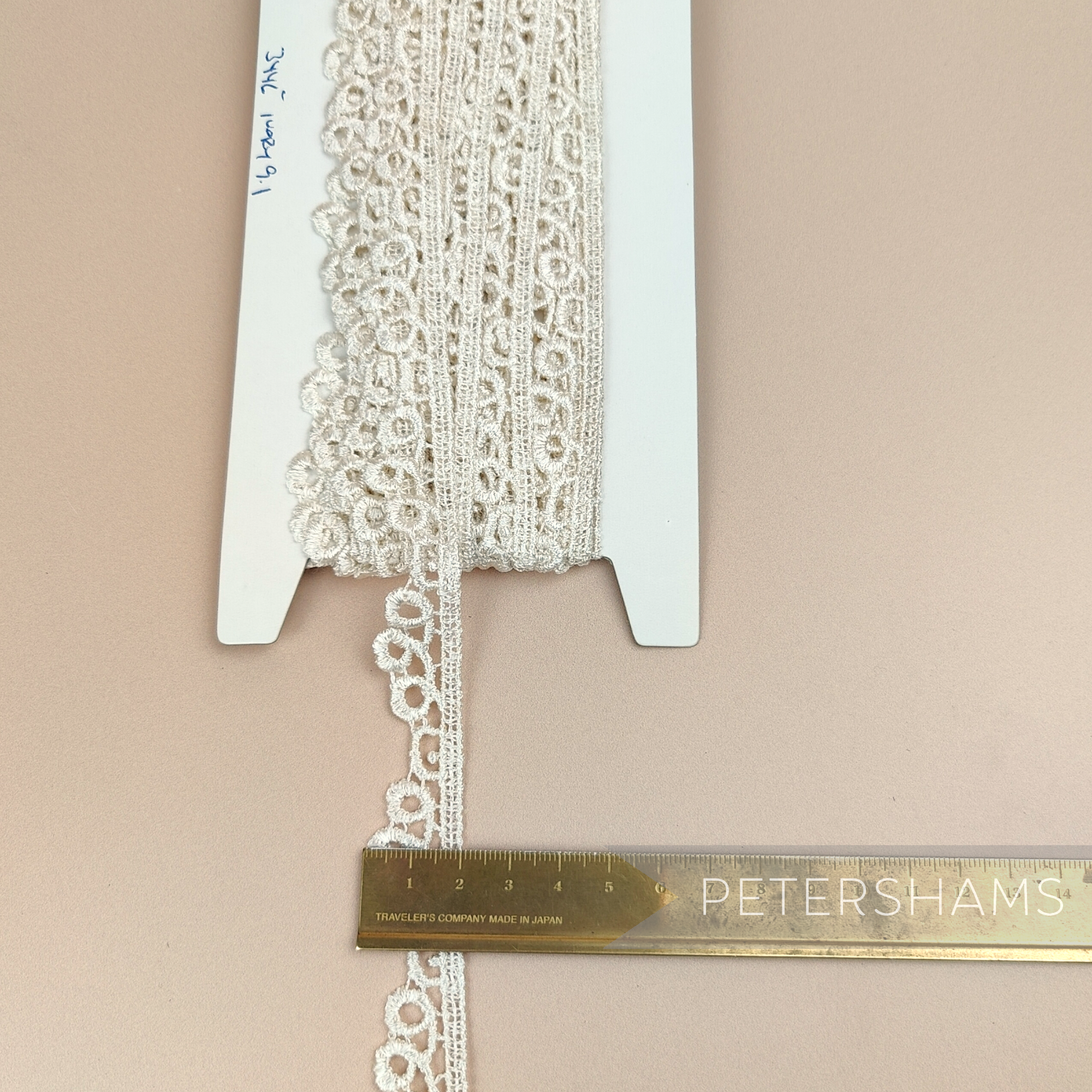 Petershams Millinery Supplies vintage 20mm ivory guipure lace trim with a loopidy loo pattern on a display card