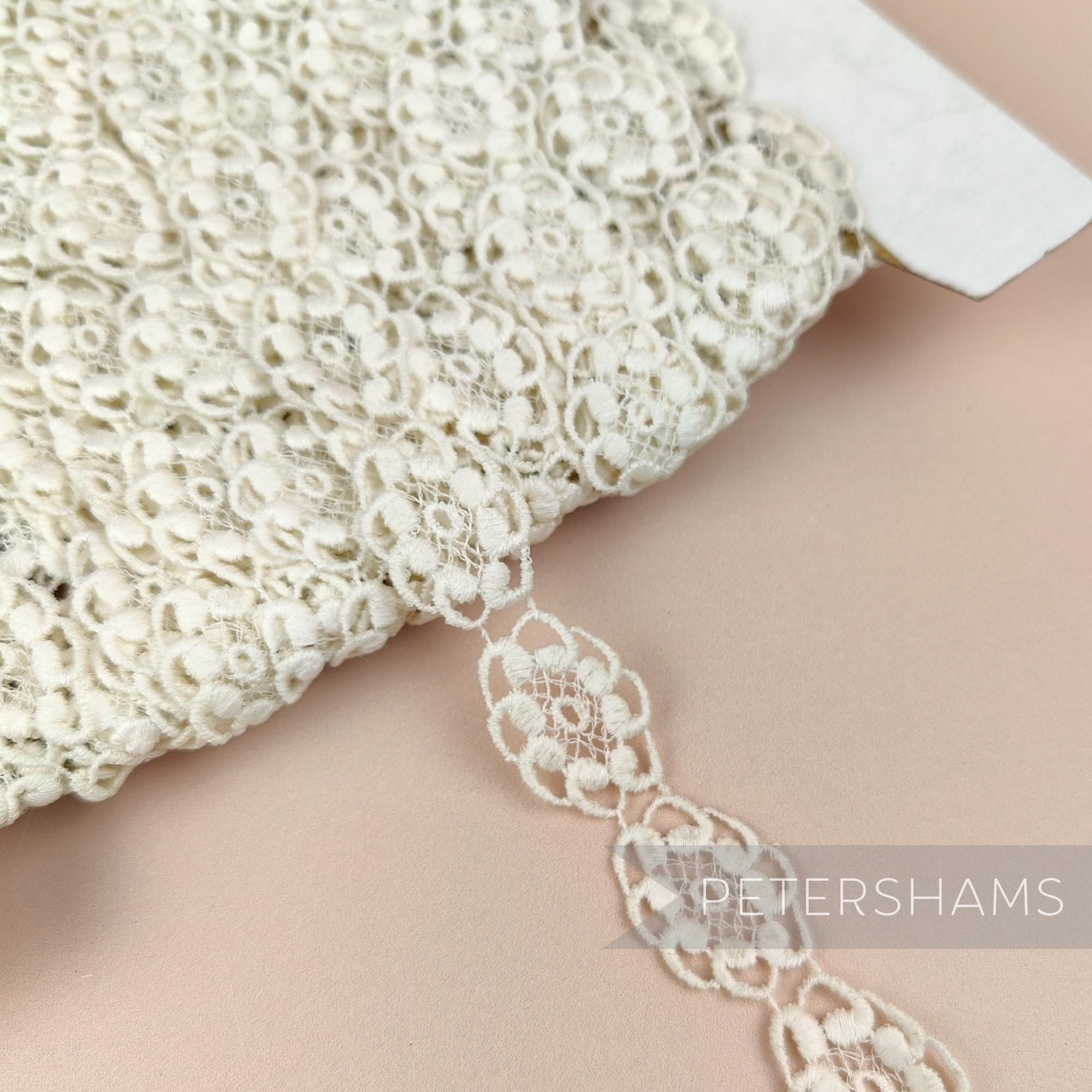 Petershams Millinery Supplies vintage ivory 20mm guipure lace trim with an oval princess design on a spool