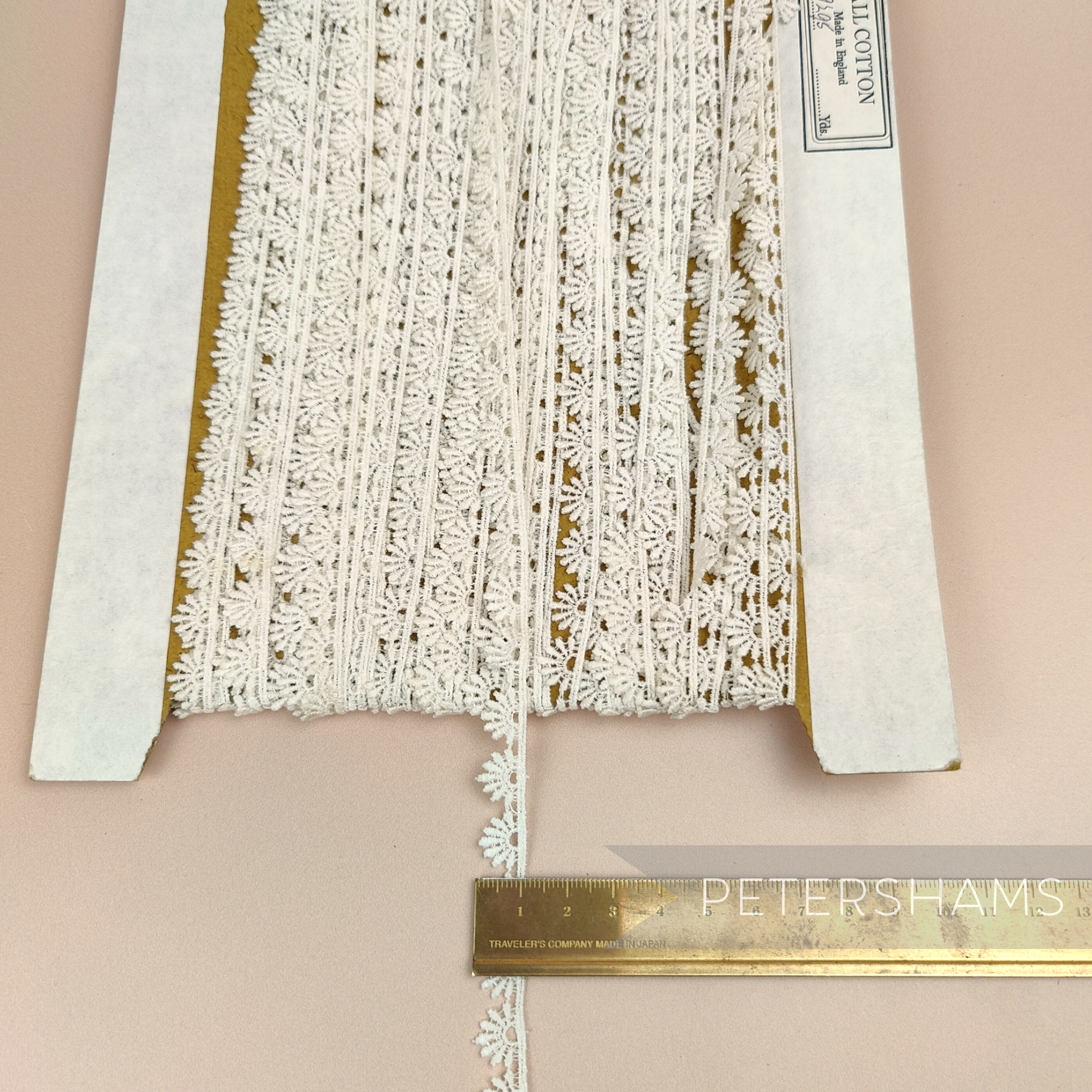 Petershams Millinery Supplies vintage 10mm ivory guipure lace trim with a radiant fan pattern on a cardboard spool