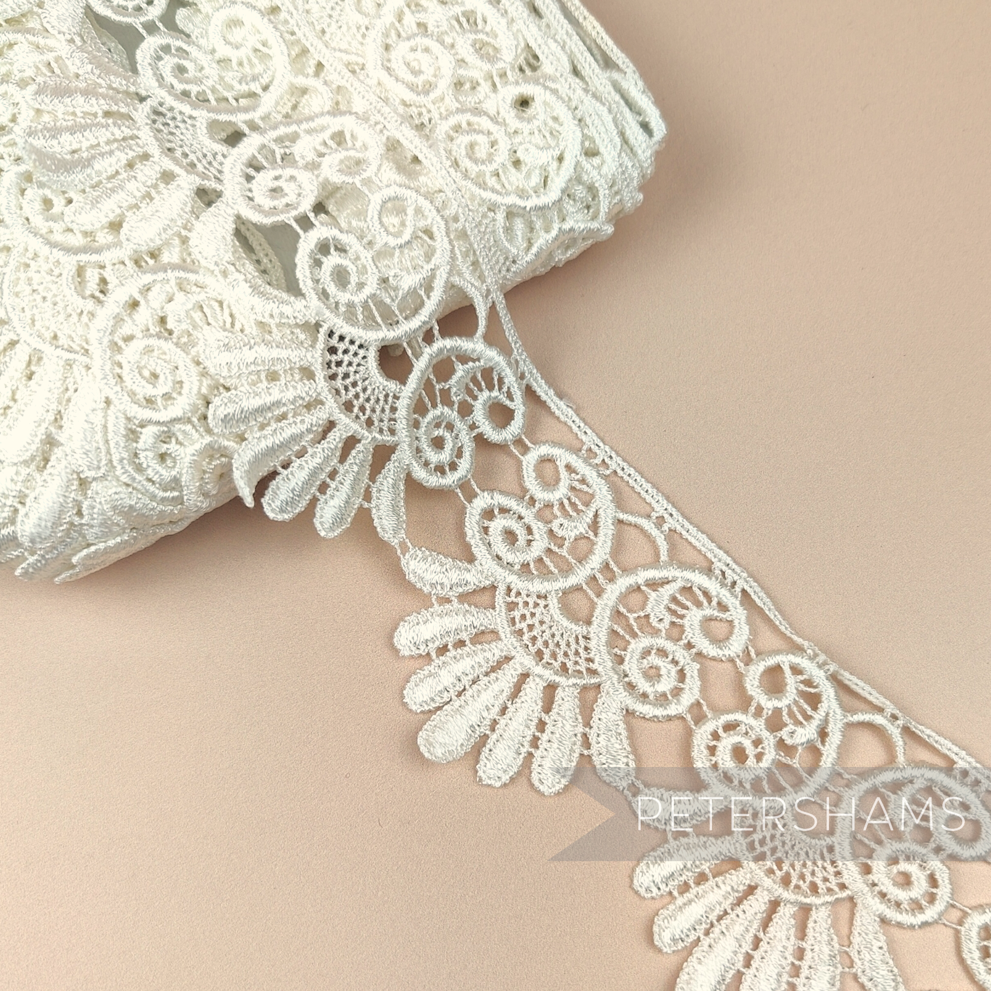 Petershams Millinery Supplies 6cm ivory guipure lace trim with a vintage-style filigree pattern and raised texture.
