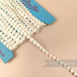 Petershams Millinery Supplies vintage 1950s ivory cotton guipure lace trim with a petite heart pattern on a card