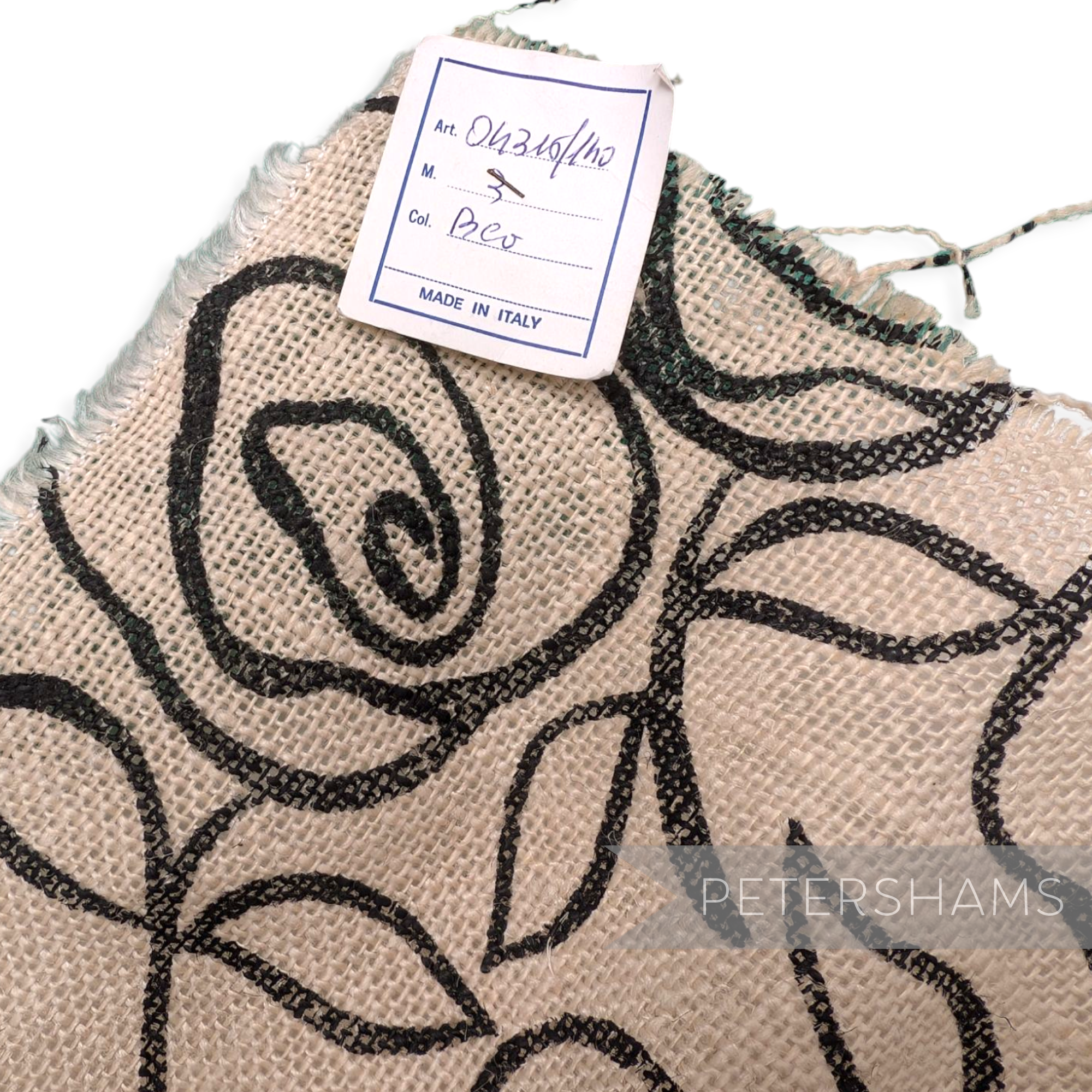 Petershams Millinery Supplies ivory jute cotton fabric with black rose print, ideal for hat trimming.
