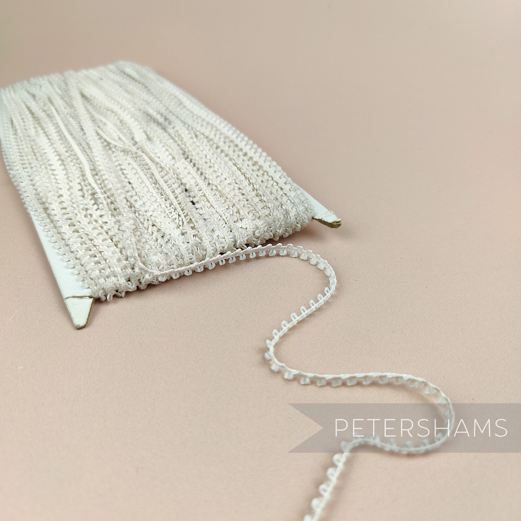 Petershams Millinery Supplies vintage ivory 5mm looped edge trim on a card for sewing and millinery projects.