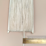 Petershams Millinery Supplies vintage ivory 5mm looped edge trim on a full card for sewing and millinery projects.