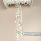 Petershams Millinery Supplies vintage ivory nylon guipure lace trim with a 40mm thatched ruffle design on a spool.